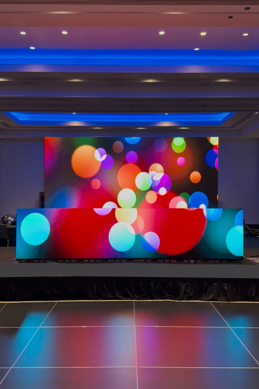 16x10 LED video wall infinity DJ booth with vibrant motion graphics for a Seattle corporate event by LightSmiths