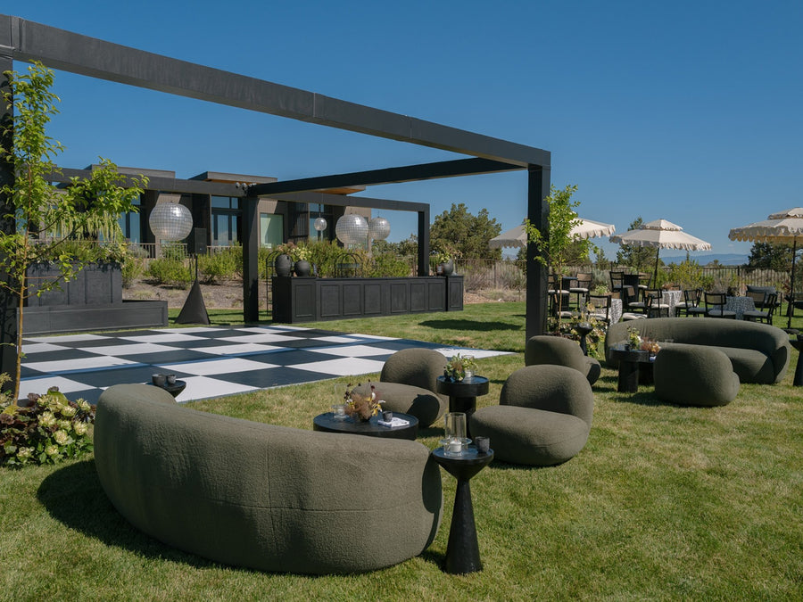 Modern outdoor wedding lounge with lounge seating adjacent to checkered dance floor and disco balls at Brasada Ranch, Bend Oregon – LightSmiths