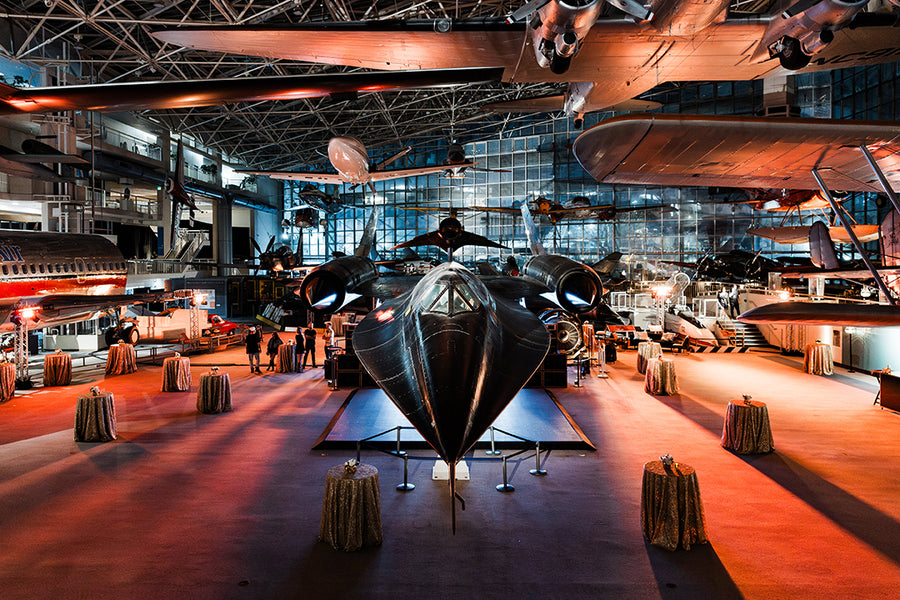 Large-scale corporate event lighting inside the Museum of Flight hangar in Seattle